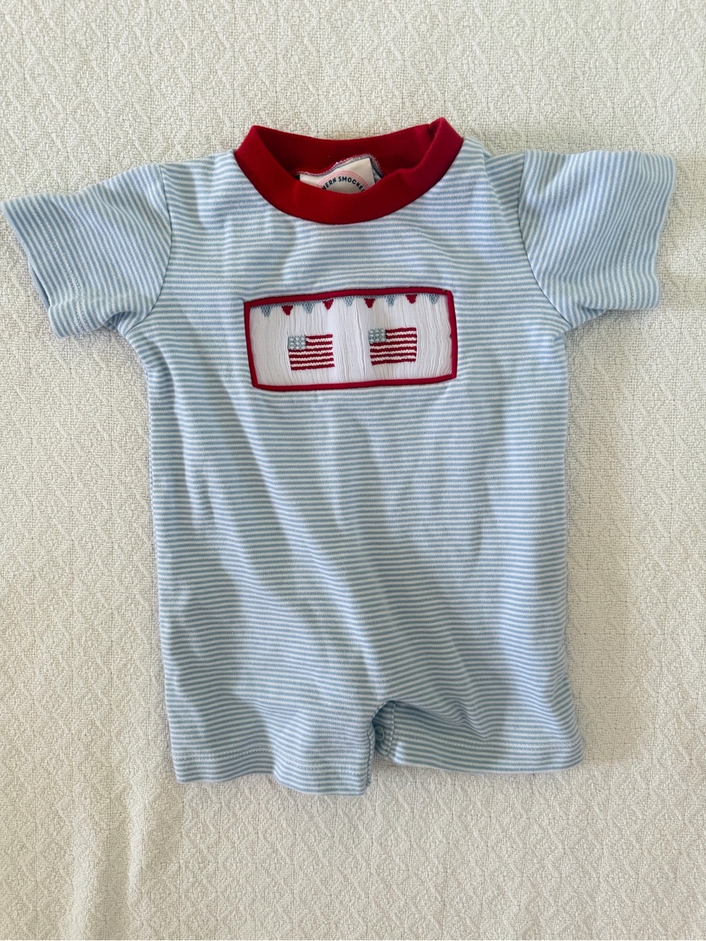 Southern Smocked Company Light Blue & White Striped Romper with Flag Smocking